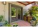 Charming patio featuring double doors, string lights, and ample plants at 1355 Euclid Ne Ave # 15A, Atlanta, GA 30307