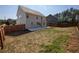 Large backyard featuring a wooden fence, offering plenty of space for outdoor activities at 2034 W Hampton Dr, Canton, GA 30115
