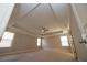 Spacious bedroom with tray ceilings, ceiling fan, neutral walls, and natural light from large windows at 2034 W Hampton Dr, Canton, GA 30115