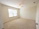 Bedroom featuring a ceiling fan, carpet, and a bright window at 2034 W Hampton Dr, Canton, GA 30115