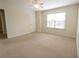 Bedroom featuring a ceiling fan, carpet, and a bright window at 2034 W Hampton Dr, Canton, GA 30115