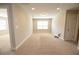 Large bonus room with plush carpet, recessed lighting, and ample natural light from the windows at 2034 W Hampton Dr, Canton, GA 30115