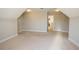 Spacious bonus room with neutral carpet and ample closet space, perfect for a playroom or home office at 2034 W Hampton Dr, Canton, GA 30115