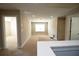 Large bonus room with carpet flooring, recessed lighting, and multiple access doors at 2034 W Hampton Dr, Canton, GA 30115