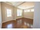 Bright dining room area featuring hardwood floors, natural light, and classic chandelier at 2034 W Hampton Dr, Canton, GA 30115