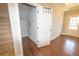 Inviting hallway entrance with hardwood floors and coat closet for added convenience at 2034 W Hampton Dr, Canton, GA 30115