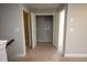 Hallway showcasing a large storage closet with storage shelves at 2034 W Hampton Dr, Canton, GA 30115