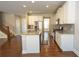 Kitchen with granite countertops, stainless steel appliances, and a view of the staircase at 2034 W Hampton Dr, Canton, GA 30115