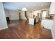 Open-concept living area with hardwood floors, modern kitchen, and a cozy fireplace, perfect for entertaining at 2034 W Hampton Dr, Canton, GA 30115