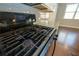 A close-up shot of the gas stove top, showcasing the burners and digital display at 2034 W Hampton Dr, Canton, GA 30115