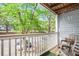 Cozy balcony with chairs, offering an outdoor seating area and neighborhood view at 233 Cobblestone Trl, Avondale Estates, GA 30002