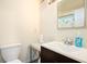 Clean bathroom with modern fixtures, including a sink, toilet, and decorative shower curtain at 233 Cobblestone Trl, Avondale Estates, GA 30002