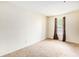 Cozy bedroom with neutral carpet and window view at 233 Cobblestone Trl, Avondale Estates, GA 30002