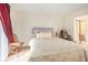 Spacious bedroom with neutral walls, comfortable bed, and relaxing decor at 233 Cobblestone Trl, Avondale Estates, GA 30002