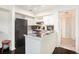 Functional kitchen with white cabinets, dark countertops, and modern appliances at 233 Cobblestone Trl, Avondale Estates, GA 30002