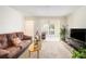 Bright living room showcasing an open layout and a comfortable seating area at 233 Cobblestone Trl, Avondale Estates, GA 30002