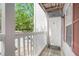 Cozy front porch with white railings and a welcoming white door at 233 Cobblestone Trl, Avondale Estates, GA 30002