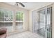 Bright sun room featuring tile flooring, large windows, and sliding glass door at 233 Cobblestone Trl, Avondale Estates, GA 30002