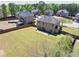 A large yard features ample space, bordered by mature trees at 2424 Malden Park Dr, Buford, GA 30519