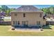 The backyard features a stone fire pit and patio area perfect for entertaining at 2424 Malden Park Dr, Buford, GA 30519