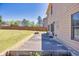 Backyard patio area with a fire pit and manicured lawn, perfect for enjoying outdoor living at 2424 Malden Park Dr, Buford, GA 30519