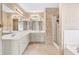 Bathroom featuring tile floors, double sink vanity, and a walk-in shower at 2424 Malden Park Dr, Buford, GA 30519