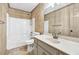 Bathroom featuring granite counters, neutral walls and flooring, and a combined shower-tub at 2424 Malden Park Dr, Buford, GA 30519
