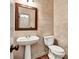 Powder room with pedestal sink and decorative wall at 2424 Malden Park Dr, Buford, GA 30519