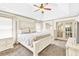 Bedroom with white wood furniture, natural lighting, and a walk through to another room at 2424 Malden Park Dr, Buford, GA 30519