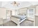 Bedroom with white wood furniture, natural lighting, and a walk through to another room at 2424 Malden Park Dr, Buford, GA 30519