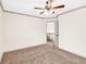 Bedroom with neutral walls, carpet and a ceiling fan, creating a bright, comfortable atmosphere at 2424 Malden Park Dr, Buford, GA 30519