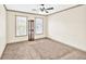 Spacious bedroom with two windows, neutral walls, carpet flooring, and modern ceiling fan at 2424 Malden Park Dr, Buford, GA 30519