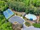 Aerial view of community pool, tennis courts, and lush landscaping at 2424 Malden Park Dr, Buford, GA 30519