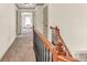 Upstairs hallway featuring neutral walls and carpeted flooring, leading to bedrooms at 2424 Malden Park Dr, Buford, GA 30519