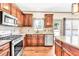 Open kitchen with an stainless steel appliances, granite countertops, and hardwood floors at 2424 Malden Park Dr, Buford, GA 30519