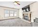Bright living room has a fireplace and large windows at 2424 Malden Park Dr, Buford, GA 30519