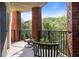 The balcony offers a peaceful retreat with comfortable seating and scenic nature views at 200 River Vista Dr # 423, Atlanta, GA 30339