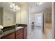 Bright bathroom with tiled flooring, granite counters and a soaking tub at 200 River Vista Dr # 423, Atlanta, GA 30339