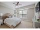 Neutral bedroom featuring a ceiling fan and bright window at 200 River Vista Dr # 423, Atlanta, GA 30339
