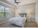 Well-lit bedroom with large window and ceiling fan at 200 River Vista Dr # 423, Atlanta, GA 30339