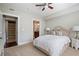 Cozy bedroom with ceiling fan, ensuite bathroom, and walk in closet at 200 River Vista Dr # 423, Atlanta, GA 30339