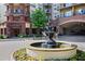 Beautiful fountain landscaping complements the brick facade of this building's exterior at 200 River Vista Dr # 423, Atlanta, GA 30339