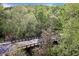 Scenic view of the community's beautiful green landscape and walking bridge at 200 River Vista Dr # 423, Atlanta, GA 30339