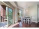 Cozy dining area with modern lighting, hardwood floors and access to the balcony at 200 River Vista Dr # 423, Atlanta, GA 30339