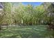 Community dog park featuring artificial turf, seating, and shade umbrella for residents' enjoyment at 200 River Vista Dr # 423, Atlanta, GA 30339
