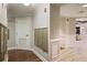 Hallway showing mailboxes and a view into lounge with elegant wall paneling and flooring at 200 River Vista Dr # 423, Atlanta, GA 30339