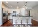 Well-lit kitchen featuring stainless steel appliances, dark counters and modern lighting at 200 River Vista Dr # 423, Atlanta, GA 30339