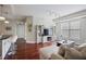 Open concept living area with hardwood floors, modern furnishings and breakfast bar at 200 River Vista Dr # 423, Atlanta, GA 30339