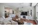 Open concept living area with hardwood floors, modern furnishings and kitchen at 200 River Vista Dr # 423, Atlanta, GA 30339