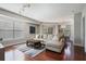 Spacious living room with hardwood floors, large windows, and comfortable furnishings at 200 River Vista Dr # 423, Atlanta, GA 30339